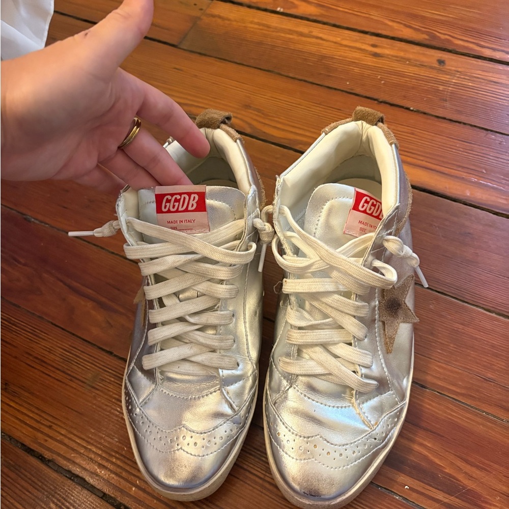 Silver Sneakers and black sneakers